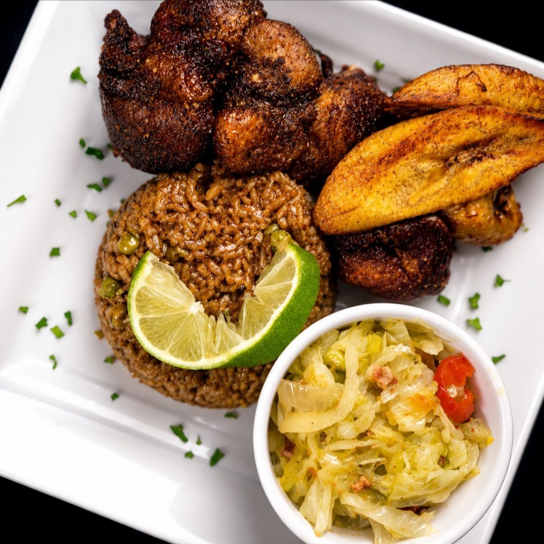 Jerk chicken with rice and peas, fried plantain and cabbage