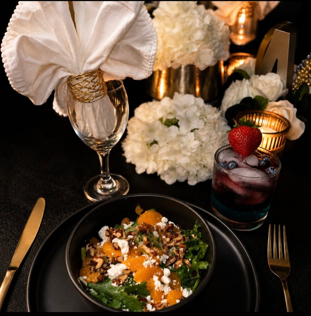 Plated salad and place setting with a layered berry cocktail